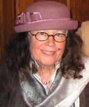 A person wearing a pink hatDescription automatically generated with medium confidence